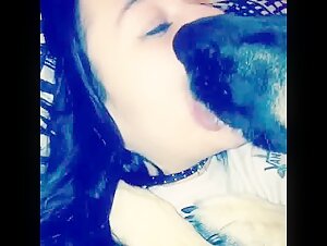 Dog kissing girl